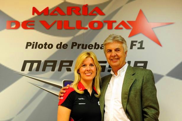 Marussia driver  Maria De Villota of Spain  poses next to her father former formula one driver Emilio de Villota